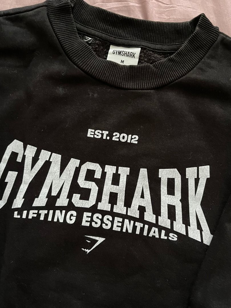 Gymshark Black Lifting Essentials Sweatshirt Size M (Category: Activewear) located in Caloocan City. Submitted by ripleyabre70238 (Listing ID 1469590203, Image 2). Description: - Brand: Gymshark - Color: Black - Size: Medium (M) - Features: Ribbed collar, cuffs, and hem - Material: Thick fleece-like inner lining, soft and cozy fabric - Condition/Use: Great for workouts or casual everyday wear.
