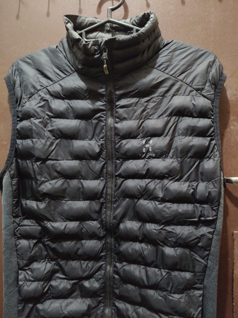 Haglöfs Black Puffer Vest (Category: Vests) located in Quezon City. Submitted by itzme_vrfr (Listing ID 1469732118, Image 1). Description: - Brand: Haglöfs - Color: Black - Style: Full zip puffer vest with stand-up collar - Features: Quilted warmth and stretch knit side panels for mobility - Branding: Logo printed on chest - Condition: Excellent - Best for: Outdoor layering or casual daily wear.