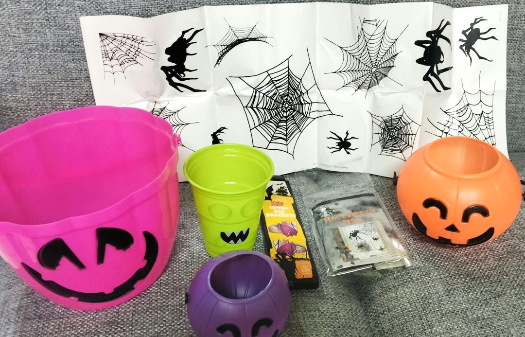 Halloween Trick or Treat Buckets and Decor Bundle (Category: Occasions & Party Supplies) located in Taguig. Submitted by Bloomscorner1 (Listing ID 1469663748, Image 2). Description: - All-in-one Halloween bundle for trick-or-treating and party decor - Includes: 1) large pink pumpkin bucket 2) Small orange pumpkin bucket 3) Extra small purple pumpkin bucket 4) Green monster cup 5) Spooky window stickers with spider web designs 6) 4 glowing bracele