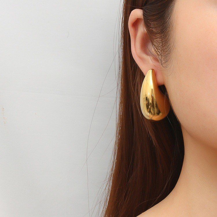 HANABI Gold Teardrop Earrings Chunky Waterdrop Studs (Category: Earrings) located in Cavite. Submitted by _schmyla (Listing ID 1469588963, Image 2). Description: - Brand: HANABI - Style: Chunky gold teardrop / waterdrop shape with a glossy polished finish - Closure: Standard post-back - Features: Lightweight, timeless minimalist design suitable for everyday wear or special occasions - Condition: Brand new in original packaging box.