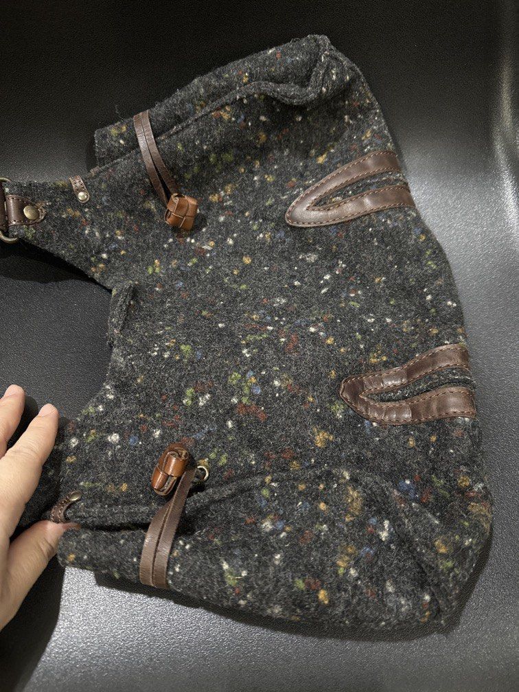 Hand Bag (Category: Shoulder Bags) located in Manila. Submitted by krystalchewey_ (Listing ID 1469582925, Image 2). Description: Used Actual Photo Posted 699php felted tweed fabrics. Crafted from a dark gray textured wool/felt fabric woven with vibrant multi-colored flecks .