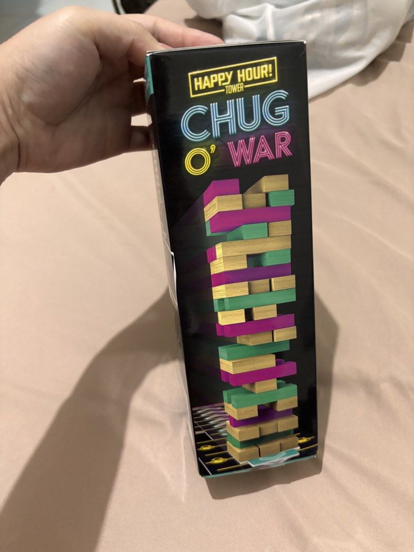Happy Hour Tower Chug O War Drinking Game (Category: Board Games & Puzzles) located in Pasay City. Submitted by _mcrnj (Listing ID 1469736262, Image 1). Description: SEALED - Product: Happy Hour Tower Chug O War drinking game - Condition: Brand new, unopened, and still sealed in original packaging - Gameplay: Tipsy tumbling tower with a tug-of-war twist - Inclusions: 48 wood blocks, 24 cards, 1 slider, 1 gameboard, and instructions - Perfect for: