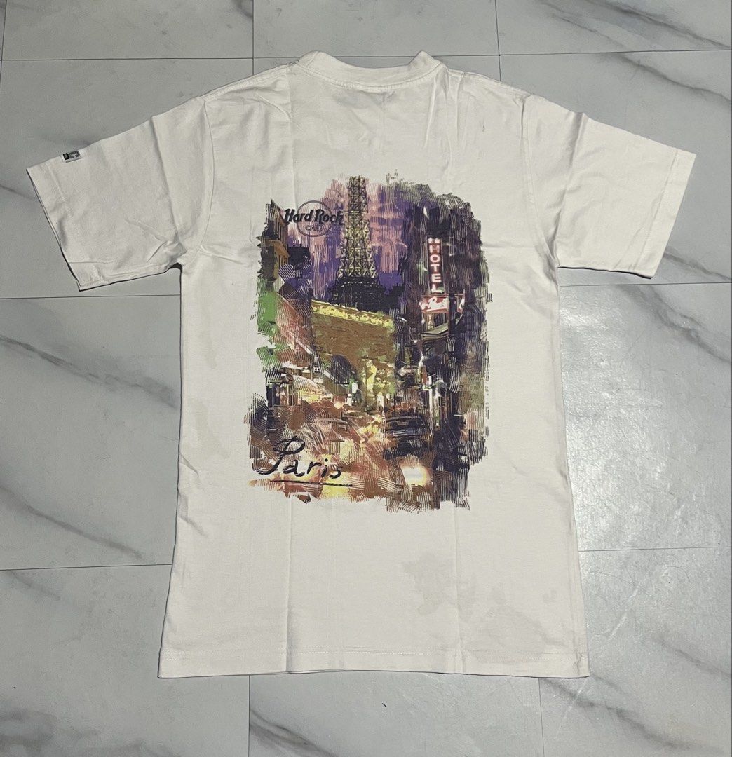 HARD TAG Hard Rock Cafe Paris Heavy Tee White Small (Category: Tshirts & Polo Shirts ) located in Cavite. Submitted by christianzuuu (Listing ID 1469603280, Image 2). Description: - Authentic Hard Rock Cafe Paris T-Shirt - Color: White - Size: Small (fits true to size) - Measurements: 17.5" pit to pit, 28.5" length - Material: Premium heavyweight cotton - Design details: Front chest logo, large Eiffel Tower back graphic, and 'HRC Built on Rock n 