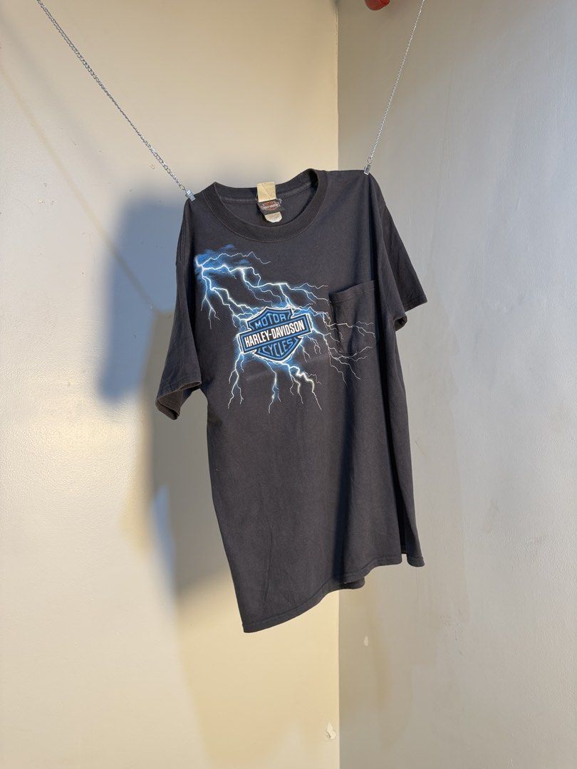 Harley Davidson Lighting Storm⚡️🇨🇳 (Category: Tshirts & Polo Shirts ) located in Manila. Submitted by sugbo_vntg (Listing ID 1469746126, Image 1). Description: Harley-Davidson “Lightning Storm” ⚡🇨🇳 A Harley Davidson logo with electric blue lightning striking across the chest and a golden eagle rises out of a ring of fire above Harley-Davidson of Shanghai China. Size: M | 20 x 28 Available🔥.
