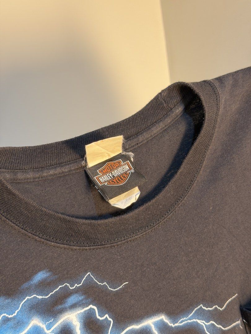 Harley Davidson Lighting Storm⚡️🇨🇳 (Category: Tshirts & Polo Shirts ) located in Manila. Submitted by sugbo_vntg (Listing ID 1469746126, Image 3). Description: Harley-Davidson “Lightning Storm” ⚡🇨🇳 A Harley Davidson logo with electric blue lightning striking across the chest and a golden eagle rises out of a ring of fire above Harley-Davidson of Shanghai China. Size: M | 20 x 28 Available🔥.