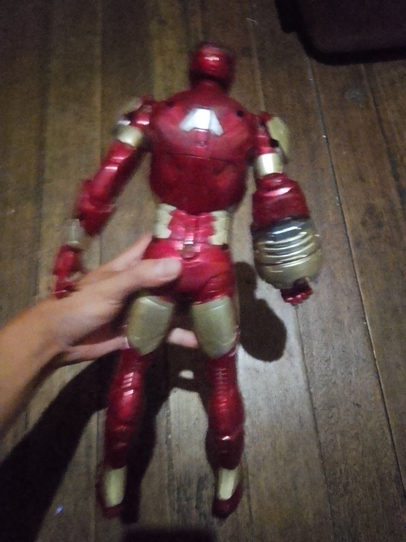 Hasbro Marvel Iron Man Action Figure 2012 (Category: Action & Battle Toys) located in Quezon City. Submitted by theoneshop1 (Listing ID 1469743440, Image 2). Description: - Authentic 2012 Hasbro Iron Man action figure - Large build with a chunky interchangeable right gauntlet - Classic red and gold armor design - Shows visible wear and scuffs from previous play - Durable, sturdy plastic construction - Perfect display piece for Marvel and Avengers