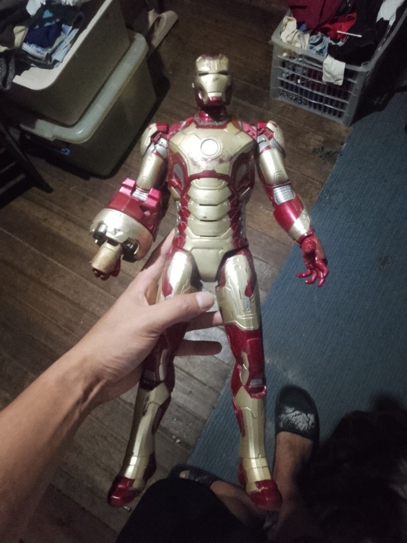 Hasbro Marvel Iron Man Action Figure 2012 (Category: Action & Battle Toys) located in Quezon City. Submitted by theoneshop1 (Listing ID 1469743440, Image 1). Description: - Authentic 2012 Hasbro Iron Man action figure - Large build with a chunky interchangeable right gauntlet - Classic red and gold armor design - Shows visible wear and scuffs from previous play - Durable, sturdy plastic construction - Perfect display piece for Marvel and Avengers