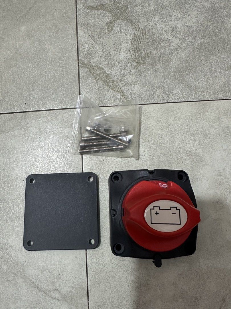 Heavy Duty Battery Disconnect Switch Master Kill Switch (Category: Electrical, Adaptors & Sockets) located in Manila. Submitted by markdelaro52517 (Listing ID 1469636335, Image 3). Description: Heavy duty battery disconnect switch. Red rotary knob with ON/OFF positions. Black square housing base measuring 68mm by 68mm. Total switch width reaches 150mm with the terminal brackets. Includes mounting plate and stainless steel screws in a sealed plast
