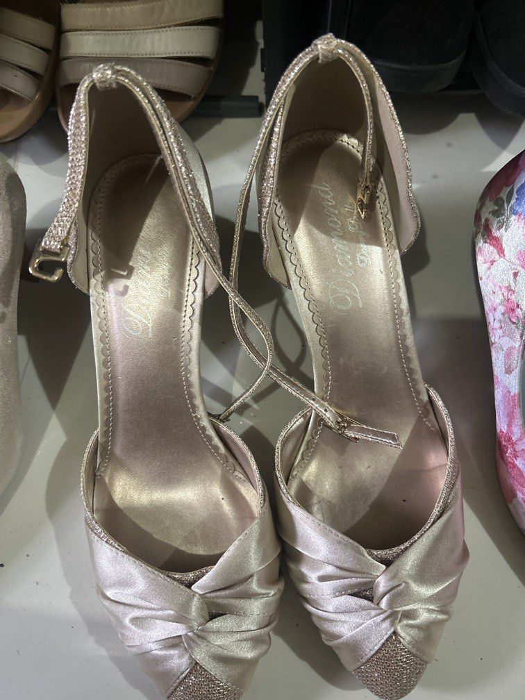 Heels champagne gold satin size 9 (Category: Heels) located in Cavite. Submitted by cecitrifthshop (Listing ID 1469631337, Image 1). Description: image shows a pair of champagne-gold satin and glitter-accented ankle-strap party pumps, size 8 to 9 .
