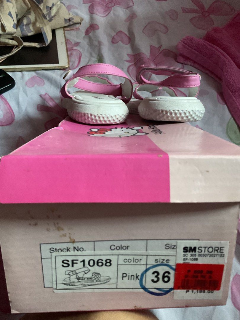 Hello Kitty Pink Platform Sandals Size 36 (Category: Flats & Sandals) located in San Juan City. Submitted by bookmarket_manila (Listing ID 1469651698, Image 2). Description: - Authentic Sanrio Kitty platform sandals - Color: Pink and white - Size: 36 - Braided strap detail and secure ankle strap with hook-and-loop closure - Cute silver Kitty charm on the side - Printed Kitty branding on the footbed - Includes original pink Sanrio shoebox from SM 