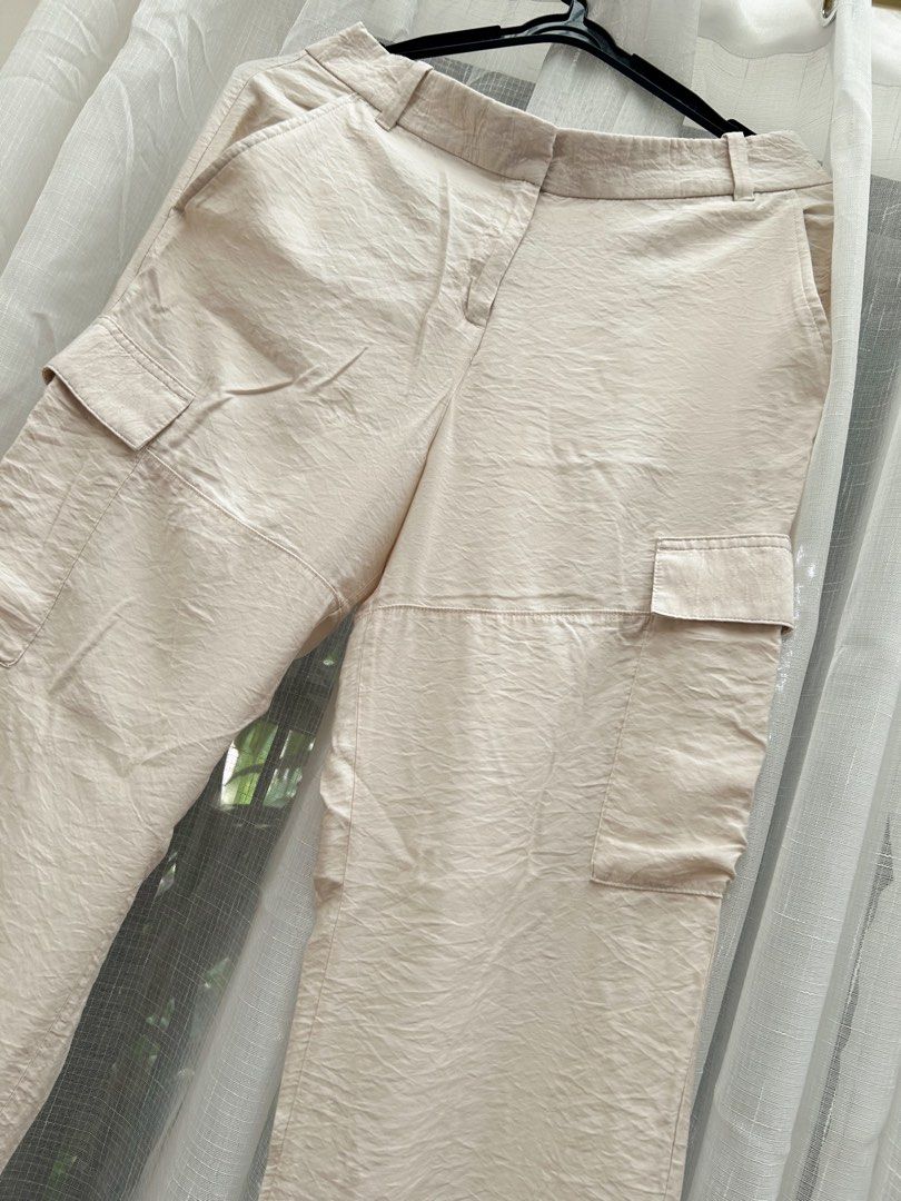 H&M Beige Cargo Satin Pants/ Trousers (Category: Jeans) located in Cainta. Submitted by unboxingstuff (Listing ID 1469652417, Image 2). Description: - Style: SATIN material - Size: EUR 46/ US 14 - Casual everyday beige cargo pants with a straight-leg cut - Can be used as business casual wear too - Pockets: Functional utility pockets on both sides - Waist: High waist with button and hook closure, plus belt loops - Material: Lightweight, comfortabl