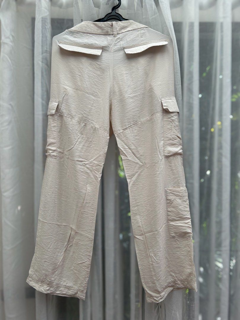 H&M Beige Cargo Satin Pants/ Trousers (Category: Jeans) located in Cainta. Submitted by unboxingstuff (Listing ID 1469652417, Image 3). Description: - Style: SATIN material - Size: EUR 46/ US 14 - Casual everyday beige cargo pants with a straight-leg cut - Can be used as business casual wear too - Pockets: Functional utility pockets on both sides - Waist: High waist with button and hook closure, plus belt loops - Material: Lightweight, comfortabl