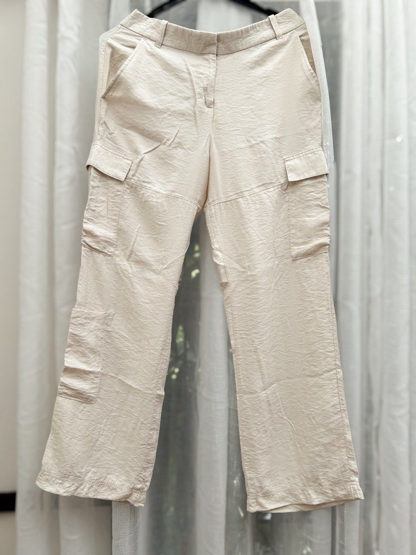 H&M Beige Cargo Satin Pants/ Trousers (Category: Jeans) located in Cainta. Submitted by unboxingstuff (Listing ID 1469652417, Image 1). Description: - Style: SATIN material - Size: EUR 46/ US 14 - Casual everyday beige cargo pants with a straight-leg cut - Can be used as business casual wear too - Pockets: Functional utility pockets on both sides - Waist: High waist with button and hook closure, plus belt loops - Material: Lightweight, comfortabl
