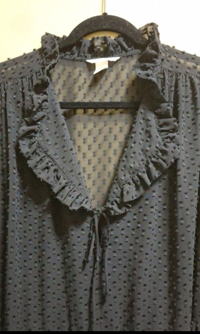 H&M Black Cocktail Dress (Category: Dresses) located in Manila. Submitted by thrifter_lifestyle (Listing ID 1469619865, Image 3). Description: Brand: H&M Long-Sleeves Ruffled V neck, tied Pull down Flowy and falls loose when worn Material: Textured thick sheer fabric, should be worn with inner Bust: 44" Waist: 42" Length: 37" (shoulder to hem) No issues, worn 1x 🙂 RFS: worn for an event, no need for it now.