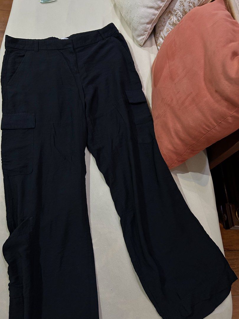 H&M Black Satin Cargo Pants/ Trousers (Category: Jeans) located in Cainta. Submitted by unboxingstuff (Listing ID 1469651387, Image 2). Description: - Style: SATIN material - Size: EUR 46/ US 14 - Casual everyday black cargo pants with a straight-leg cut - Can be used as business casual wear too - Pockets: Functional utility pockets on both sides - Waist: High waist with button and hook closure, plus belt loops - Material: Lightweight, comfortabl