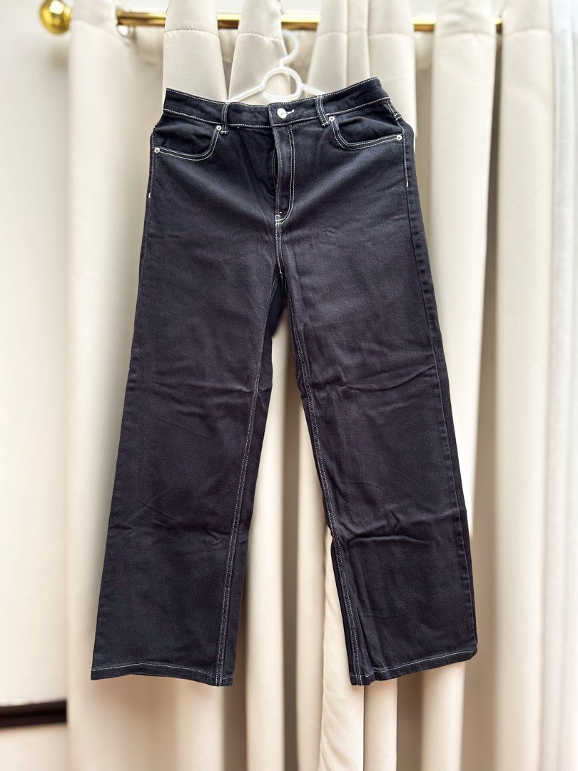 H&M Black Wide Leg Pants (Category: Jeans) located in Cainta. Submitted by unboxingstuff (Listing ID 1469623933, Image 1). Description: - Style: Black wide leg denim pants with trendy white contrast stitching - Fit: High waist with button and zip fly closure - Size: EUR 44 / US 12 - Details: Standard five-pocket setup - Condition: Clean denim, perfect solid everyday staple - Altered hem .