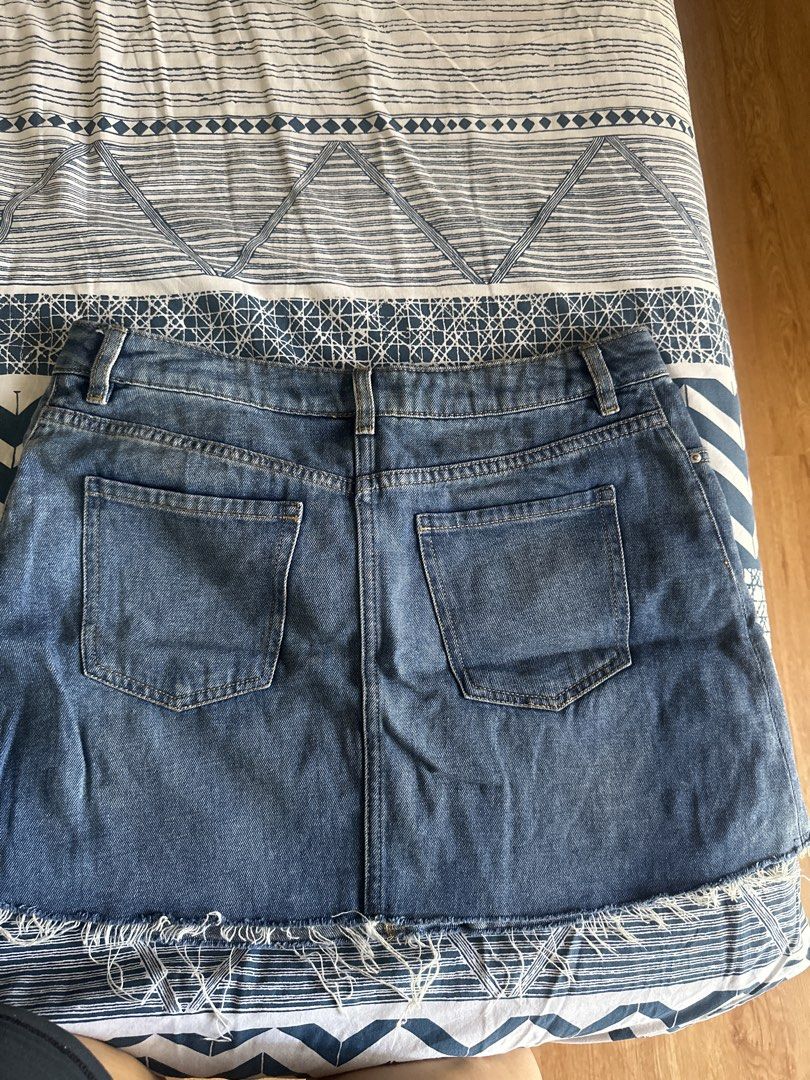 H&M Divided Denim Skirt Size US 8 (Category: Skirts) located in Manila. Submitted by amazingamie8 (Listing ID 1469581405, Image 2). Description: - Brand: H&M Divided - Style: Denim skirt with raw frayed hem - Wash: Medium blue - Size: EUR 38 / US 8 / CN 165/72A - Details: Classic five-pocket styling, zip fly, and button closure - Condition: Good staple piece for casual everyday outfits.
