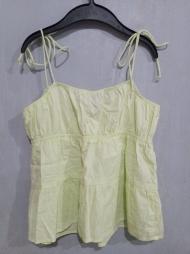 H&M Divided Lime Green Tiered Cami Top (Category: Sleeveless) located in Bacoor. Submitted by thriftworksph (Listing ID 1469602744, Image 2). Description: - Brand: H&M Divided - Color: Lime Green - Size: EUR 36 / US 4 / CN 165/84A - Design: Square neckline, tie shoulder straps, front tie closure - Details: Smocked bodice with a tiered flowy hem - Material: Lightweight, ideal for warm weather.