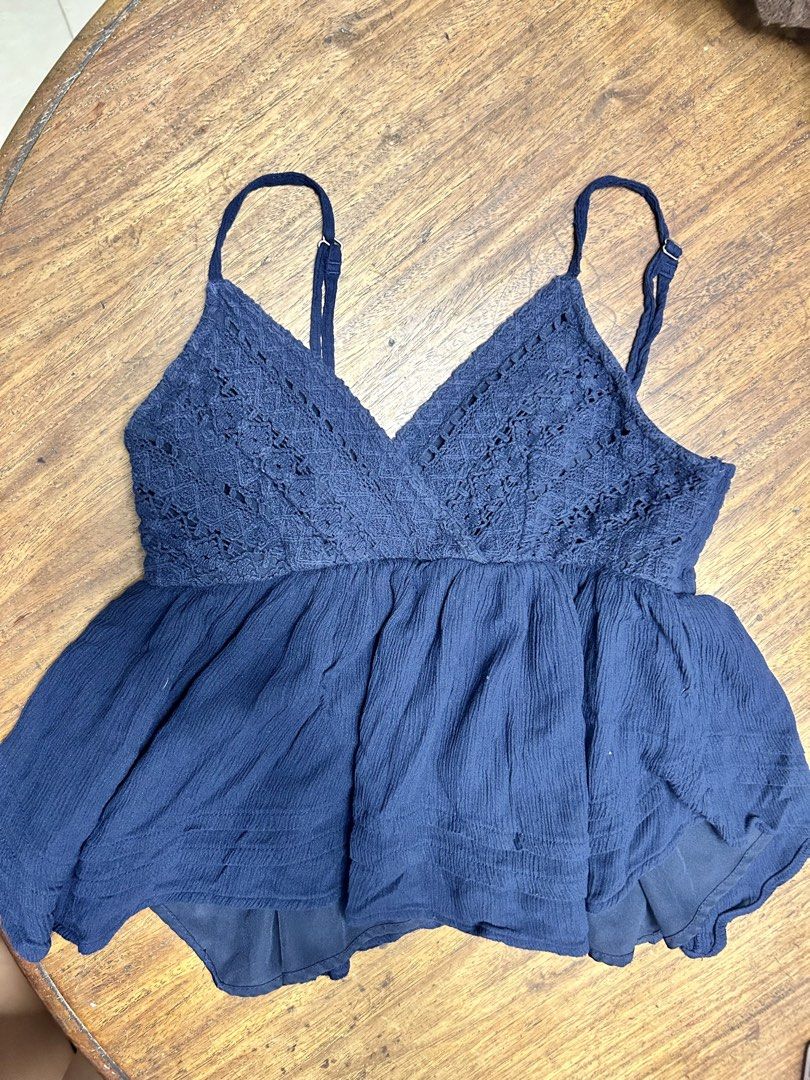 Hollister Top (Category: Sleeveless) located in Antipolo. Submitted by tshopph (Listing ID 1469605834, Image 1). Description: Navy Blue Crochet Lace Babydoll Cami Top Super cute navy blue boho-style cami top. Features a lace/crochet detailed V-neck with adjustable spaghetti straps and a flowy, babydoll fit. Perfect for beach trips, summer days, or casual layering 🌊✨ Condition: like new Size: medium Price: 350 Same-day delivery via Lalamove / Gra