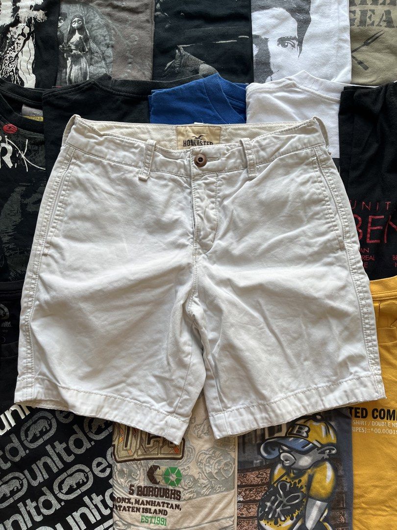 Hollister White Chino Shorts (Category: Shorts) located in Baao. Submitted by plainclothesdept (Listing ID 1469696902, Image 2). Description: hollister white relaxed shorts waist - 28 in. length - 17 in. hem - 10 in. discoloration - Brand: Hollister - Item: Men's Chino Shorts - Color: White - Closure: Classic button fly with branded buttons - Pockets: Front slash pockets and rear welt pockets - Details: Embroidered gull logo on the back pocket - 