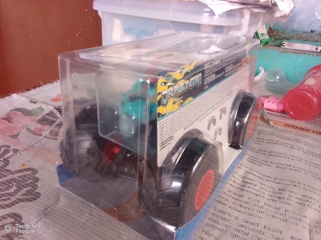 Hot Wheels Monster Trucks Dragonizer (Category: Vehicle & Diecast Models) located in Manila. Submitted by carlo419 (Listing ID 1469581867, Image 3). Description: - Model: Hot Wheels Monster Trucks Dragonizer - Design: Teal green body with fierce dragon and flame graphics - Wheels: Oversized black tires with striking bright orange rims - Material: Durable metal and plastic construction - Scale: Standard monster truck size (packaged in original cle