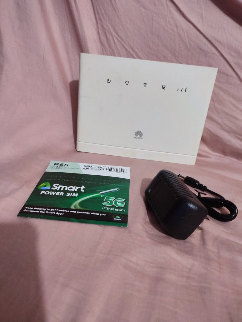 Huawei WiFi Router with Power Adapter and Smart SIM (Category: Networking) located in Quezon City. Submitted by jobert1988 (Listing ID 1469632256, Image 1). Description: - Brand: Huawei White Wireless Router - Condition: Clean and fully functional - Inclusion 1: Original power adapter block - Inclusion 2: Brand new, unopened Smart 5G Power SIM pack - Features: Standard desktop unit with top status indicator lights - Setup: Plug and play, perfect 