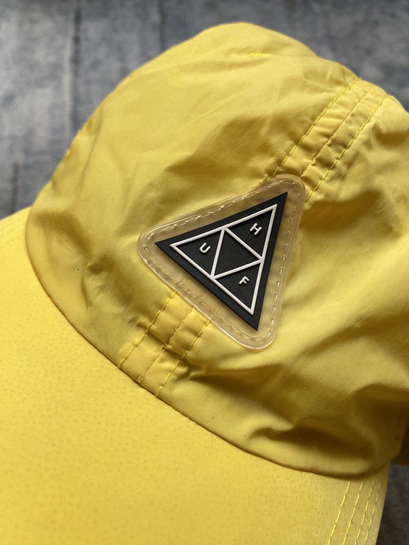 HUF Aurora Dad Hat (Category: Caps & Hats) located in Manila. Submitted by kiddrevoo (Listing ID 1469711179, Image 2). Description: HUF Aurora Dad Hat “Blazing Yellow” This unstructured 6-panel strapback cap is constructed from a lightweight, quick-dry nylon fabric. It features an adjustable strap, top ventilation eyelets, and a curved visor. The front is styled with a distinct raised rubber or silicone translucent triangular patch enclosing the 