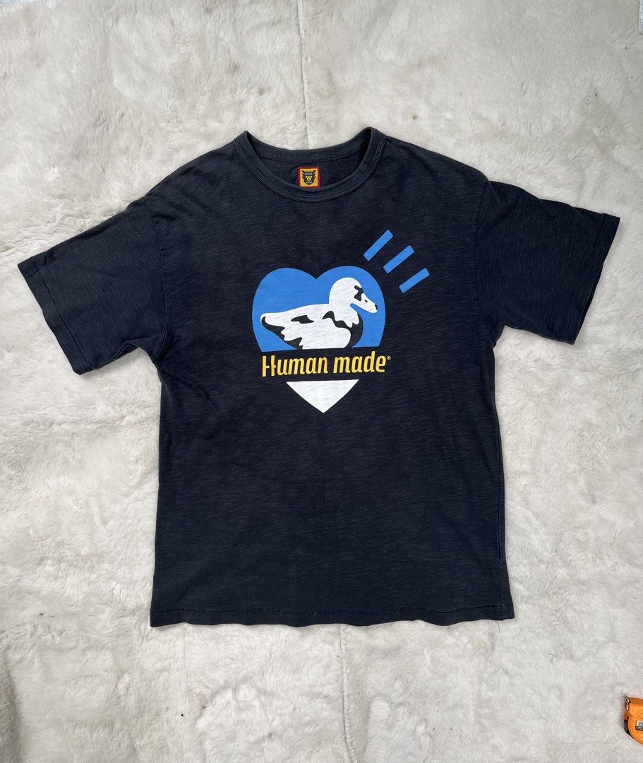 Human Made - Men’s Duck Graphic Tee Ash Grey (Category: Tshirts & Polo Shirts ) located in Naga. Submitted by fresh_fit (Listing ID 1469728355, Image 2). Description: Human Made - Men’s Duck Graphic Tee Ash Grey - Black short sleeve t-shirt by Human Made. - Large duck and heart graphic printed on the chest with yellow branding text. -Small duck logo tag sewn inside the collar. - Soft cotton fabric with slight vintage wash look. Size: Medium on ta