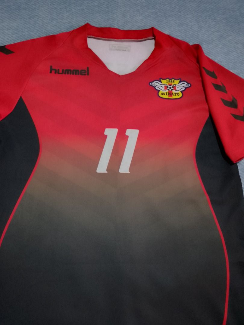Hummel Soccer Jersey Red Black (Category: Babies & Kids Fashion) located in Bayombong. Submitted by daily10 (Listing ID 1469627840, Image 3). Description: - Brand: Hummel - Est Size: 150 - Dimensions: 17" x 23" inches - Club: Minato 1985 - Design: Red and black gradient with number 11 on the front - Details: Hummel logo on right chest, iconic chevrons on both sleeves - Neckline: V-neck collar - Material: Lightweight and breathable fabric -All Ite