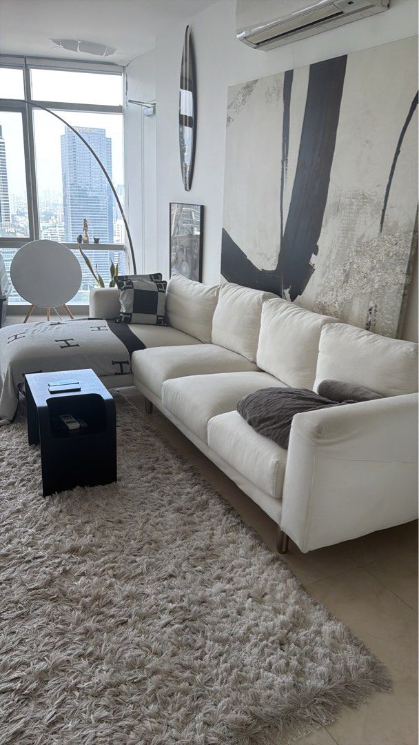 IKEA 4 seater Modern White Sectional Sofa with Chaise (Category: Sofas) located in Makati City. Submitted by ownersellerbgc (Listing ID 1469597413, Image 1). Description: - Type: White sectional sofa with built-in chaise lounge Norsborg model - Design: Neutral upholstery that matches most living room layouts - Features: Comfortable cushions and sturdy metal legs - Condition: Used but can be cleaned - Perfect for family lounging and entertaining g