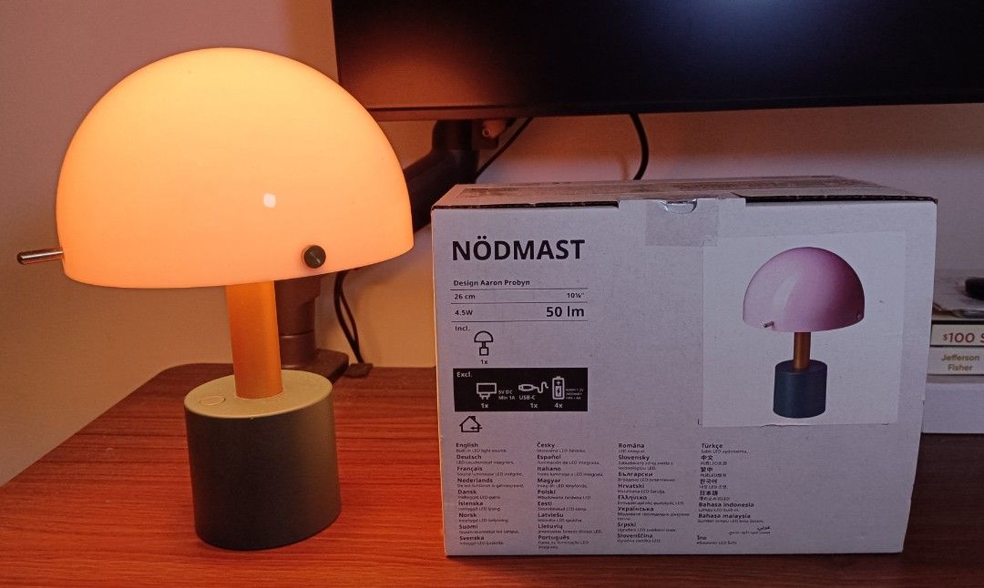 IKEA NÖDMAST Table Lamp Aaron Probyn (Category: Lighting) located in Marikina City. Submitted by goldenwind_866e51 (Listing ID 1469594927, Image 2). Description: - Authentic IKEA NÖDMAST table lamp designed by Aaron Probyn - Features a trendy mushroom dome in light pink, orange-toned stem, and dark green base - Dimensions: 26 cm tall - Lighting: Soft warm light at 50 lm powered by a 4.5W LED - Condition: Comes with original retail box, well-maint