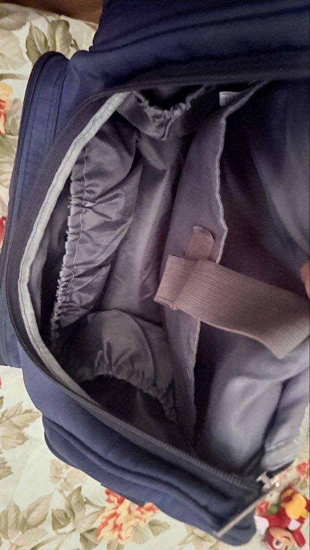 Insular Navy Blue Quilted Diaper Backpack (Category: Backpacks) located in San Pablo. Submitted by dtanne (Listing ID 1469730699, Image 3). Description: - Color: Navy blue with clean dark fabric throughout - Material/Design: Quilted pattern with a structured top flap - Pockets: Front zippered pocket, dual side pockets, and multiple interior elasticized slip compartments - Compartments: Built-in padded divider with a secure velcro strap - Straps: 