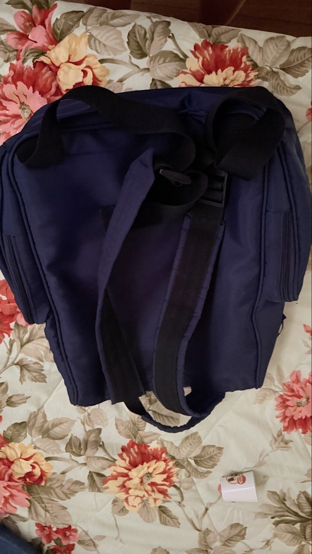 Insular Navy Blue Quilted Diaper Backpack (Category: Backpacks) located in San Pablo. Submitted by dtanne (Listing ID 1469730699, Image 2). Description: - Color: Navy blue with clean dark fabric throughout - Material/Design: Quilted pattern with a structured top flap - Pockets: Front zippered pocket, dual side pockets, and multiple interior elasticized slip compartments - Compartments: Built-in padded divider with a secure velcro strap - Straps: 