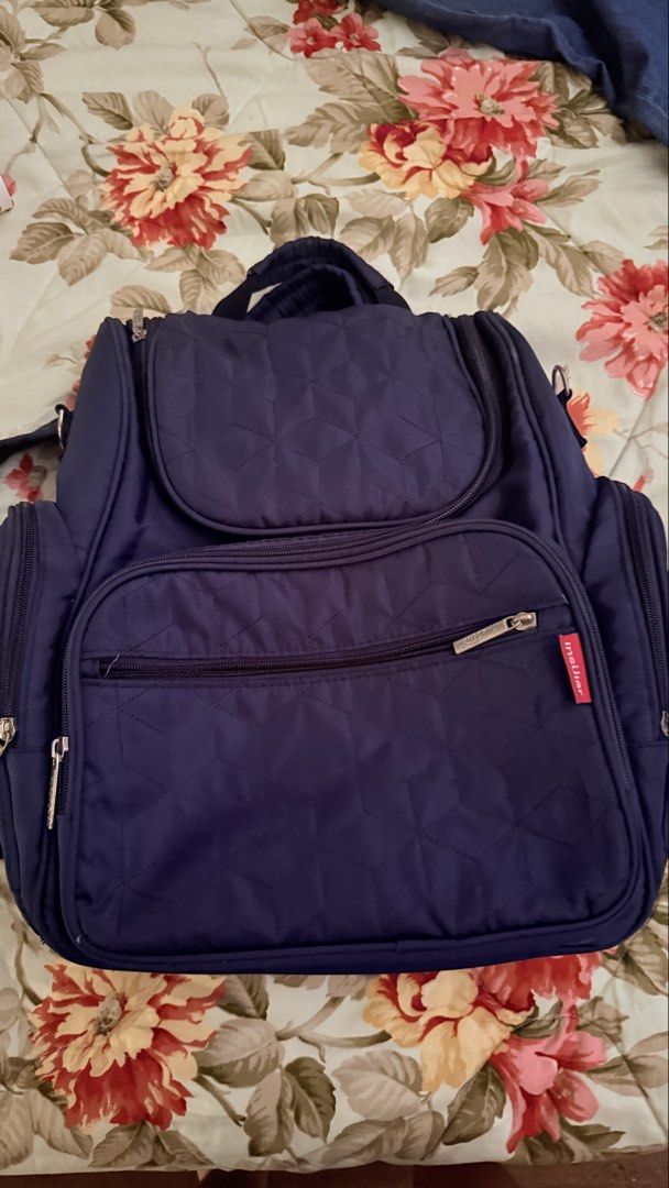 Insular Navy Blue Quilted Diaper Backpack (Category: Backpacks) located in San Pablo. Submitted by dtanne (Listing ID 1469730699, Image 1). Description: - Color: Navy blue with clean dark fabric throughout - Material/Design: Quilted pattern with a structured top flap - Pockets: Front zippered pocket, dual side pockets, and multiple interior elasticized slip compartments - Compartments: Built-in padded divider with a secure velcro strap - Straps: 