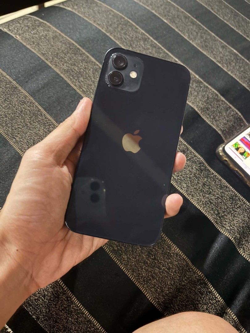 iPhone 12 (Category: iPhone 12 Series) located in Manila. Submitted by joweeeeeemmm (Listing ID 1469692922, Image 2). Description: FOR SALE: iPhone 12 64gb Price: ₱[10,500] Black 64GB Battery Health: 83% Unit itself walang cord.