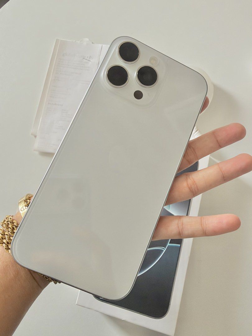 iPhone 16 Pro Max White Titanium (Category: iPhone 16 Series) located in Cebu City. Submitted by clyshoppe (Listing ID 1469645891, Image 2). Description: FOR SALE! GOOD AS NEW! * Bought at NUSTAR * Meetup or pickup in Lapu-Lapu City * Good as new, open to any SIM * Battery health: 92% * No scratches or dents * With screen protector since Day 1 * Cash only (no swaps or trades) Inclusions: Original receipt, Original box, Manual, SIM ejector, Cable,