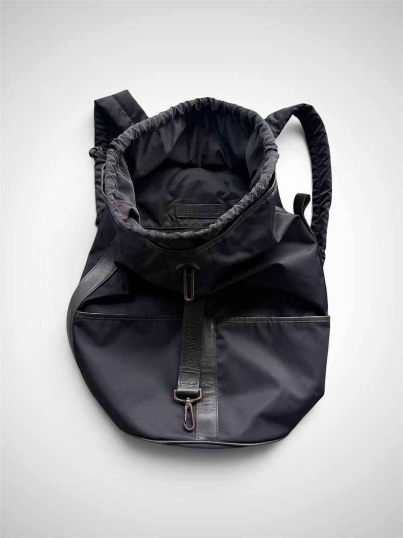 Issey Miyake 1990s Nylon Leather Rucksack Backpack (Category: Backpacks) located in Zamboanga. Submitted by the.angura.store (Listing ID 1469573093, Image 3). Description: Issey Miyake 1990s Nylon Leather Rucksack Backpack This piece is an archival nylon and leather modular rucksack from visionary Japanese designer Issey Miyake, originating in the late 1990s. Renowned for innovative fabric manipulation and utilitarian elegance, Miyake crafted acc