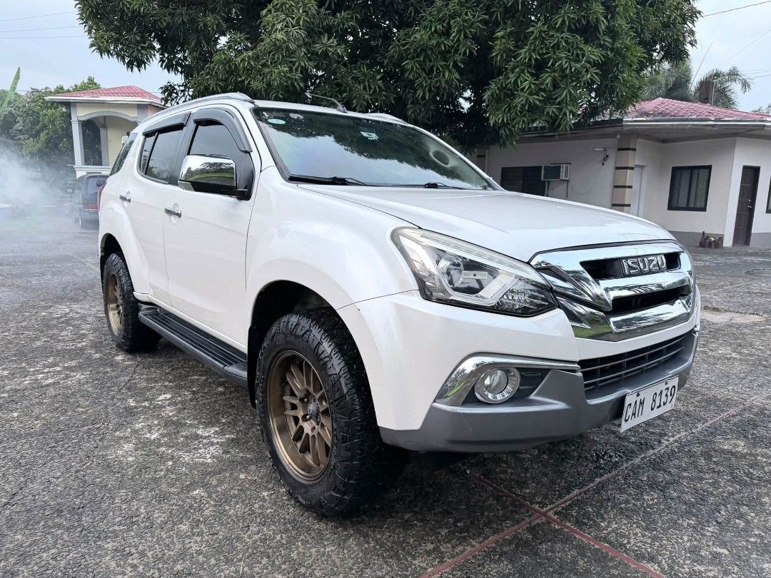 Isuzu Mu-X (Category: Used Cars) located in Manila. Submitted by eln_cars_dexter_uy (Listing ID 1469722808, Image 2). Description: 2019 ISUZU MUX BLUE POWER TOP OF THE LINE First owner acquired Pearl white Powerful engine yet economical Matic trans ( tiptronic + - ) All power Keyless entry Push start / smart key Steering control Touchscreen cd/dvd/ headunit With 10inch roofmount lcd monitor With back camera Power seat Leather seats New tires and 