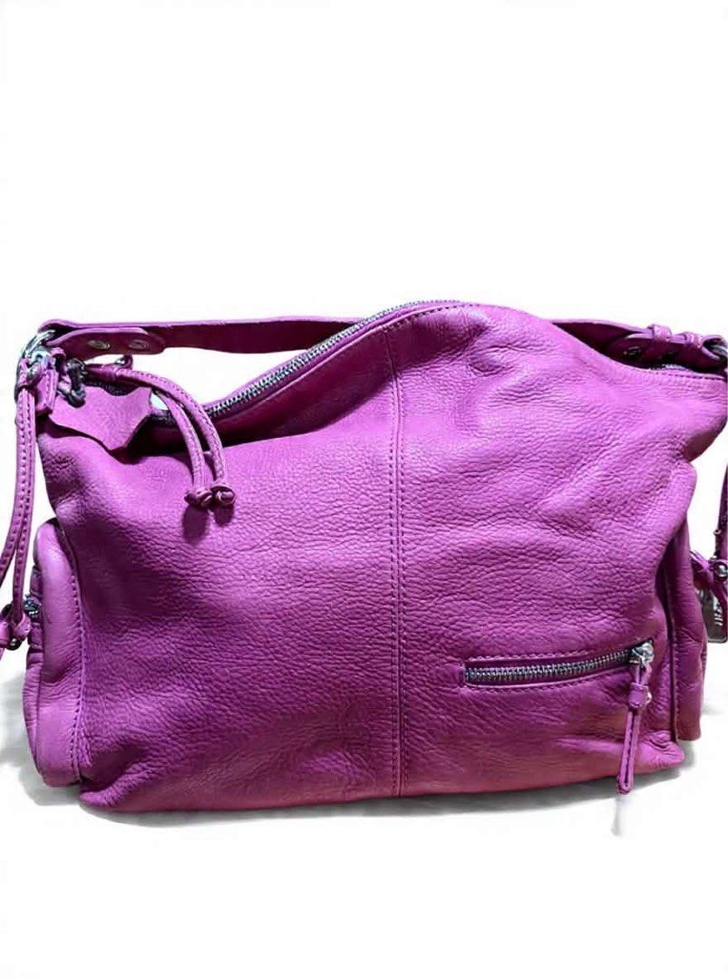 Jill Scott's Pink Leather Hobo Bag (Category: Luxury Bags & Wallets) located in Cavite. Submitted by bags_unltd143 (Listing ID 1436292580, Image 3). Description: Jill Scott hobo bag is crafted from pink leather. It features a top handle, a main compartment with a zipper closure, and exterior pockets. The bag has a silver-tone logo tag and silver hardware..