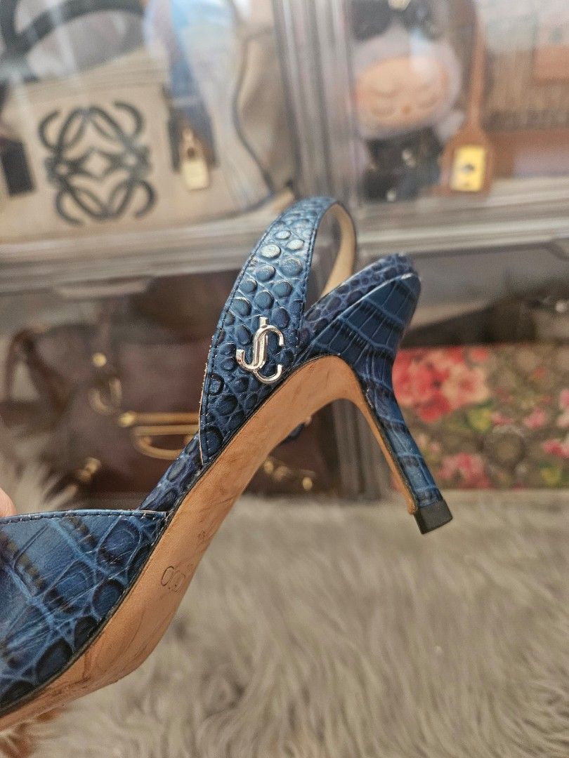 Jimmy Choo Blue Croc-Embossed Slingback Heels (Category: Heels) located in Manila. Submitted by missyyyxx (Listing ID 1469587670, Image 2). Description: rare vintage jimmy choo 💙 this is a vintage/used item already so please manage your expectations. :) - Style: Croc-embossed leather slingback heels with pointed toe and kitten heel - Color: Dark Blue - Size: 36 (Made in Italy) - Details: Silver-tone Jimmy Choo logo hardware on the strap.