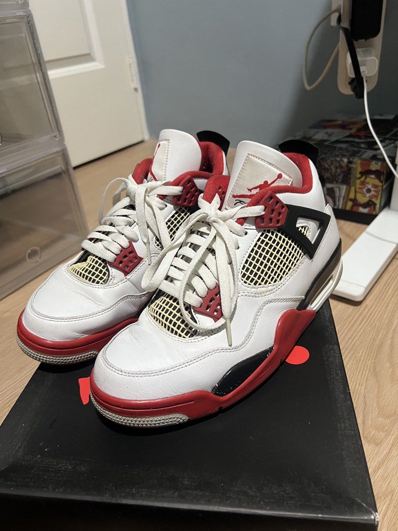 Jordan 4 Retro Fire Red Size 10 (Category: Sneakers) located in Manila. Submitted by aru_eudela (Listing ID 1469713923, Image 1). Description: - Model: Jordan 4 Retro Fire Red - Size: Men's US 10 - Colorway: White/Red-Black with iconic mesh netting - Inclusions: Original black box with size sticker - Condition: Light toe box creasing, minor paint chipping on midsoles, and slight dirt on soles - Overall: Well-maintained, clean look, and a must-hav