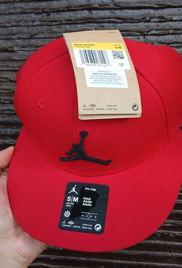Jordan Pro Cap Red S/M (Category: Caps & Hats) located in San Mateo. Submitted by edayz709 (Listing ID 1469579304, Image 2). Description: - Authentic Jordan Pro Cap in striking red with embroidered black Jumpman logo - Flat brim style with adjustable snapback closure for a custom fit - Interior taped seams featuring the iconic "Quality Inspired By The Greatest Player Ever" stamp - Size: S/M adult unisex - Condition: Brand new with all original ta
