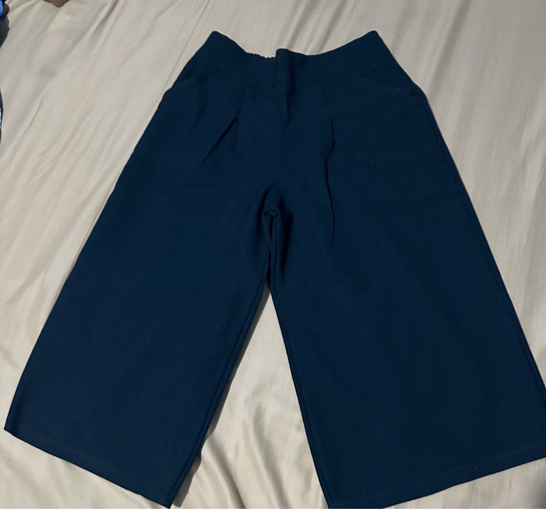 Kamiseta blouse (Category: Blouses) located in Bulacan. Submitted by mithi09 (Listing ID 1469690664, Image 1). Description: - Color: Dark blue - Style: Wide leg culottes, cropped ankle length - Fit: High waist cut with front pleats and slip-on design - Features: Functional side pockets and clean hems - Fabric: Thick, structured material that holds its shape nicely.