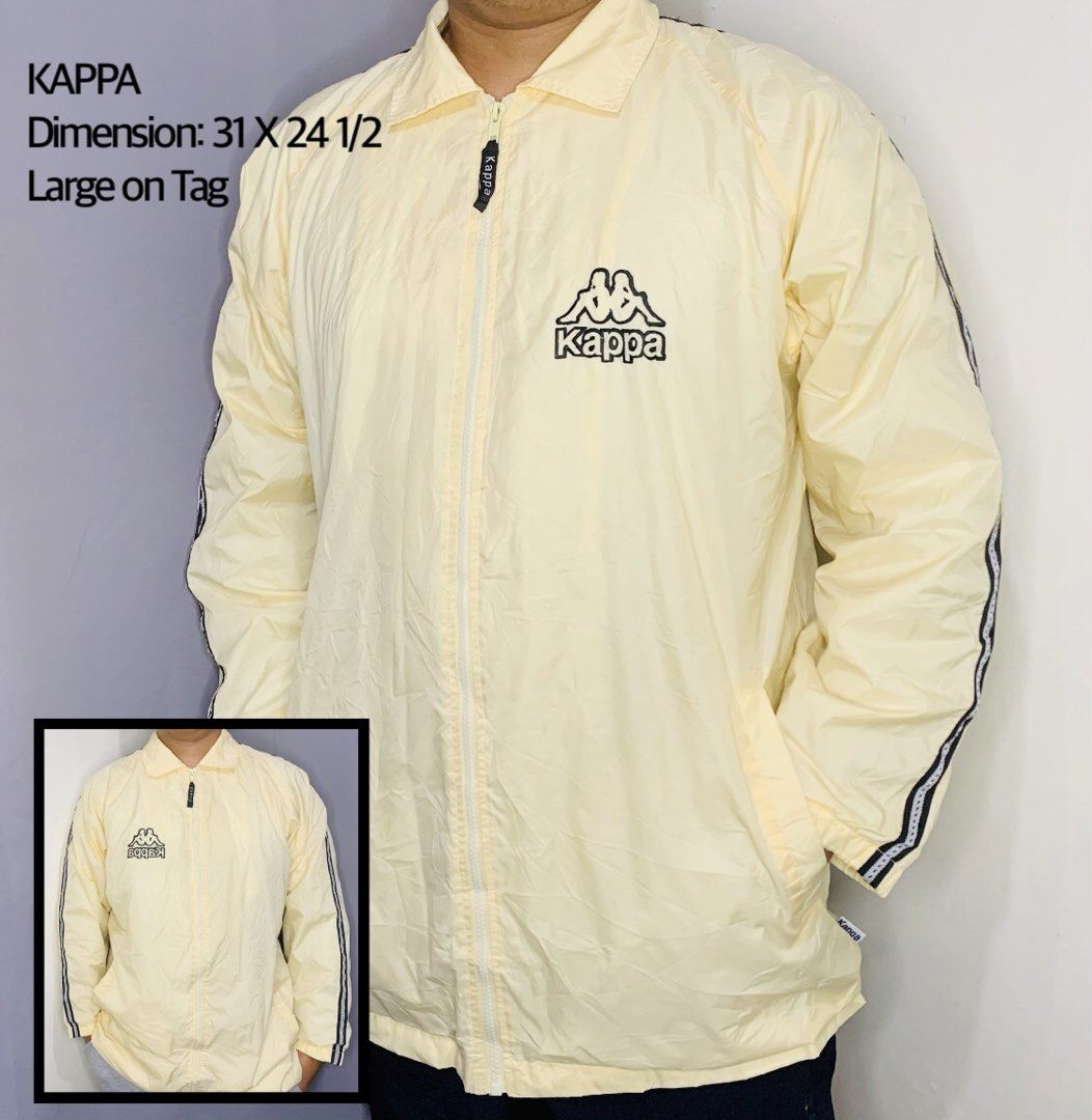 Kappa Light Yellow Windbreaker Jacket Large (Category: Coats, Jackets and Outerwear) located in Taguig. Submitted by citytrendsph (Listing ID 1469660196, Image 1). Description: - Brand: Kappa - Color: Light yellow - Size: Large (Measurements: 31" length x 24.5" width) - Design: Full zip front with branded pull tab, classic embroidered chest logo, and sleeve tape detailing - Features: Functional side pockets - Condition/Use: Great layering piece f