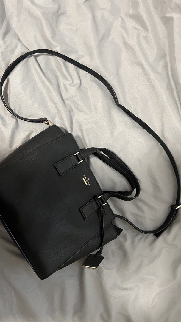 Kate Spade Cameron Street Small Hayden (Category: Luxury Bags & Wallets) located in Manila. Submitted by beas30 (Listing ID 1469630932, Image 1). Description: - Color & Material: Premium black leather with elegant gold hardware and logo lettering - Structure: Structured shape with dual top handles and a detachable shoulder strap - Interior: Chic black-and-white striped lining with a convenient zip compartment and brand tag - Closure: Secure zip-t