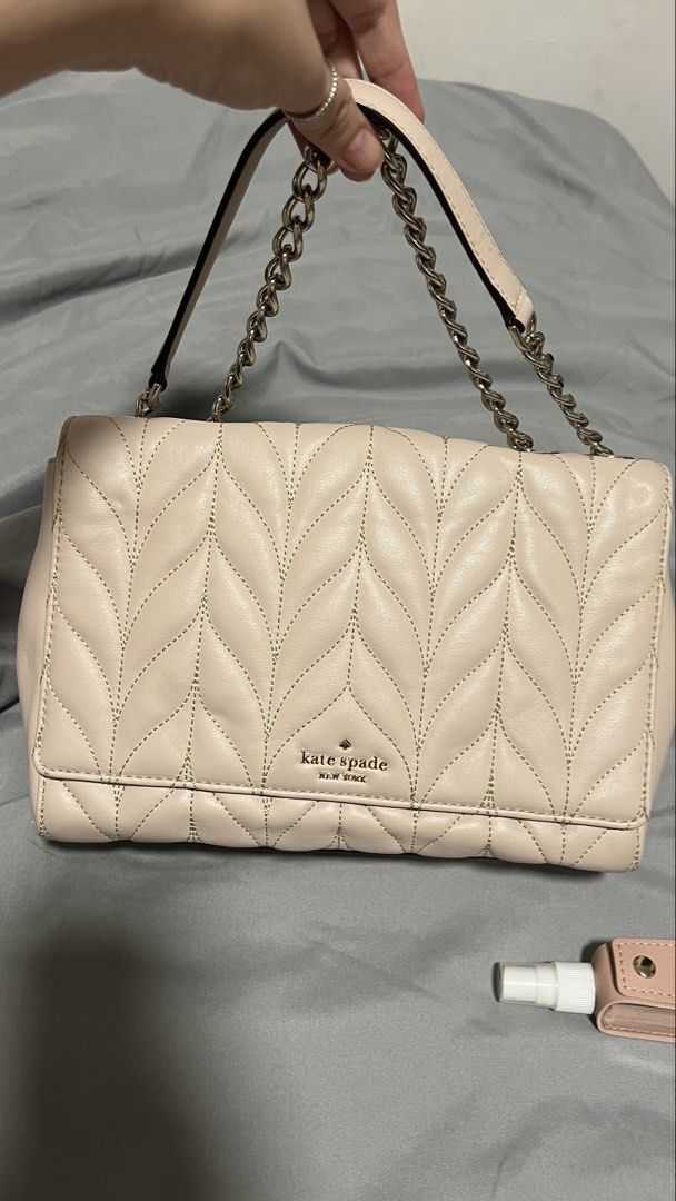Kate Spade Quilted Leather Shoulder Bag (Category: Luxury Bags & Wallets) located in Manila. Submitted by beas30 (Listing ID 1469737271, Image 1). Description: - Brand: Kate Spade New York - Material: Premium pale pink leather with chevron quilted pattern - Hardware: Elegant silver-tone hardware and metal lettering logo - Strap: Stylish chain and leather combination - Closure: Secure magnetic snap closure - Interior: Signature spade logo fabric l