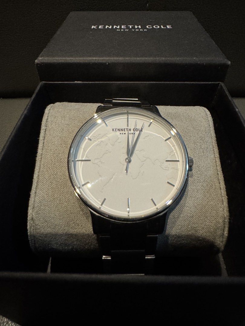 Kenneth Cole New York World Map Dial Edition (Category: Men's Watches) located in Las Pinas. Submitted by whiskyking04907 (Listing ID 1469721757, Image 1). Description: Display Type: Analog Dial Color: Silver Movement: Quartz Case Material: Stainless Steel Case Diameter: ~40 mm Case Thickness: ~8 mm Band Material: Stainless Steel Water Resistance: 30 meters (3 ATM / 100 feet) Crystal: Protected by standard scratch-resistant mineral glass. Style P