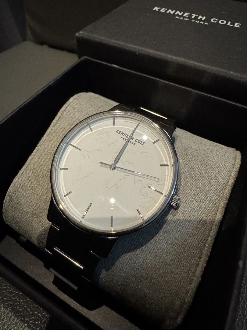 Kenneth Cole New York World Map Dial Edition (Category: Men's Watches) located in Las Pinas. Submitted by whiskyking04907 (Listing ID 1469721757, Image 2). Description: Display Type: Analog Dial Color: Silver Movement: Quartz Case Material: Stainless Steel Case Diameter: ~40 mm Case Thickness: ~8 mm Band Material: Stainless Steel Water Resistance: 30 meters (3 ATM / 100 feet) Crystal: Protected by standard scratch-resistant mineral glass. Style P