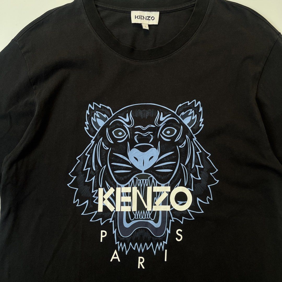 Kenzo Paris Printed Tiger Logo Shirt (Category: Tshirts & Polo Shirts ) located in Nasugbu. Submitted by janstuffs.ph (Listing ID 1469744055, Image 3). Description: Kenzo Paris Printed Tiger logo 💯Legit! Size: Large on tag Width: 21" Length: 28" Condition: 9.5/10 Excellent Flaw: NONE Mine: 780.