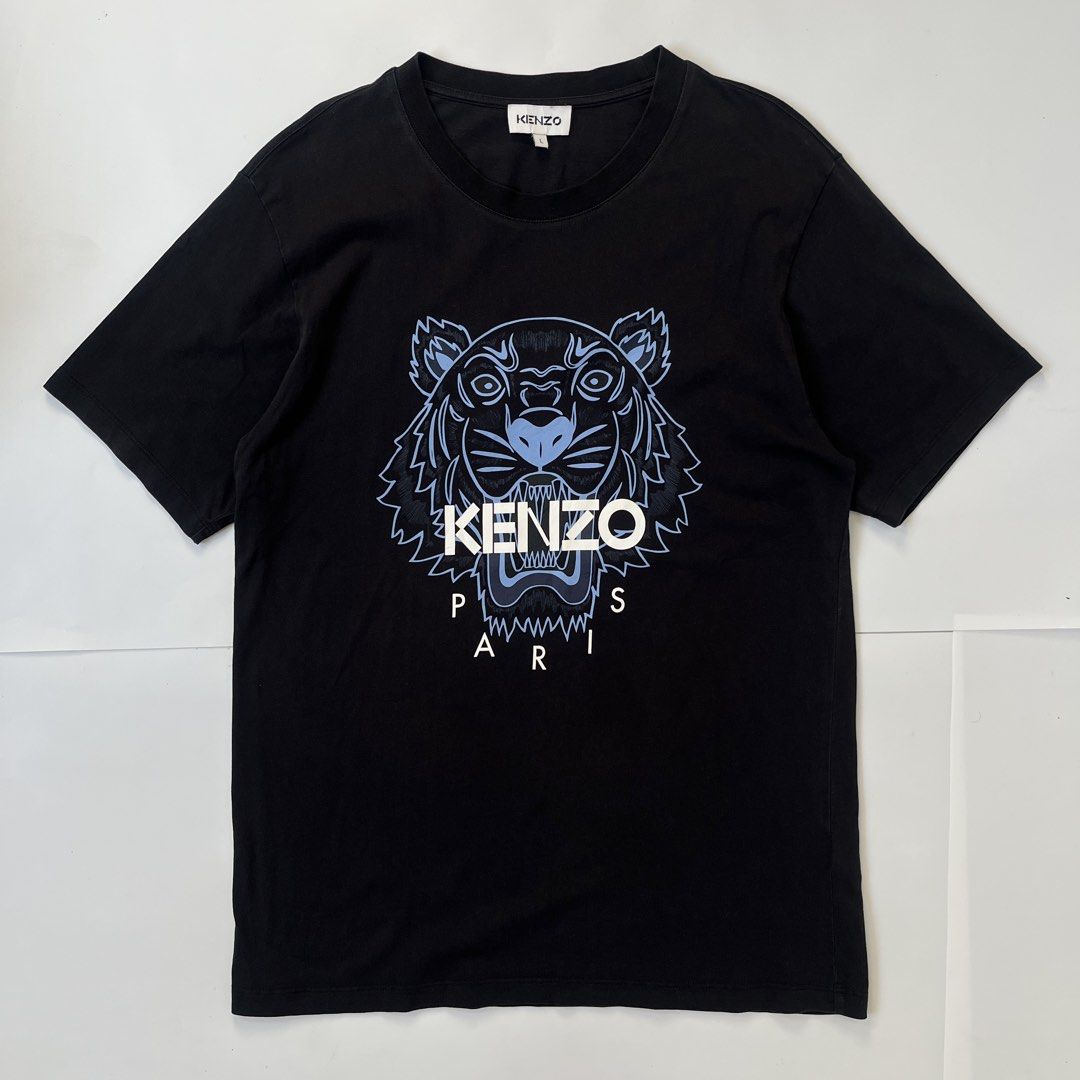 Kenzo Paris Printed Tiger Logo Shirt (Category: Tshirts & Polo Shirts ) located in Nasugbu. Submitted by janstuffs.ph (Listing ID 1469744055, Image 1). Description: Kenzo Paris Printed Tiger logo 💯Legit! Size: Large on tag Width: 21" Length: 28" Condition: 9.5/10 Excellent Flaw: NONE Mine: 780.